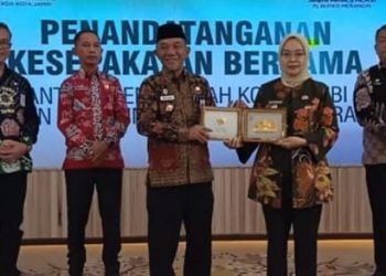 Pj Bupati Merangin Tandatangani MoU dengan Pemkot Jambi Tentang Pengembangan Pembangunan Potensi Daerah