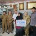 Pj Wali Kota Jambi Serahkan Santunan Jaminan Kematian kepada Keluarga Ketua RT