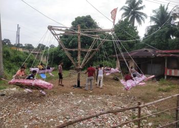 Lebaran Idul Fitri, Anak-Anak Bersemangat Naik Buaian Putar di Desa Sungai Ulak Kabupaten Merangin