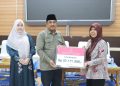 Bupati Tanjab Barat Salurkan Bantuan Beras Fortivit untuk Anak Stunting dan Bantuan ATENSI Kemensos