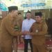 Camat Singkut Hadiri Penyaluran Zakat untuk 270 Warga, Bupati Hurmin Serahkan Bantuan di Sidomukti